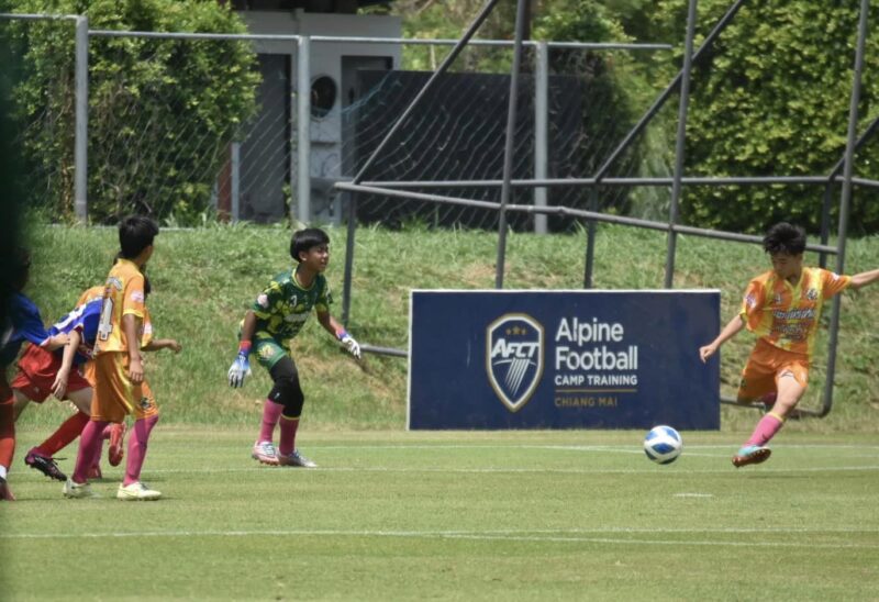 Kids play football at Alpine Football 